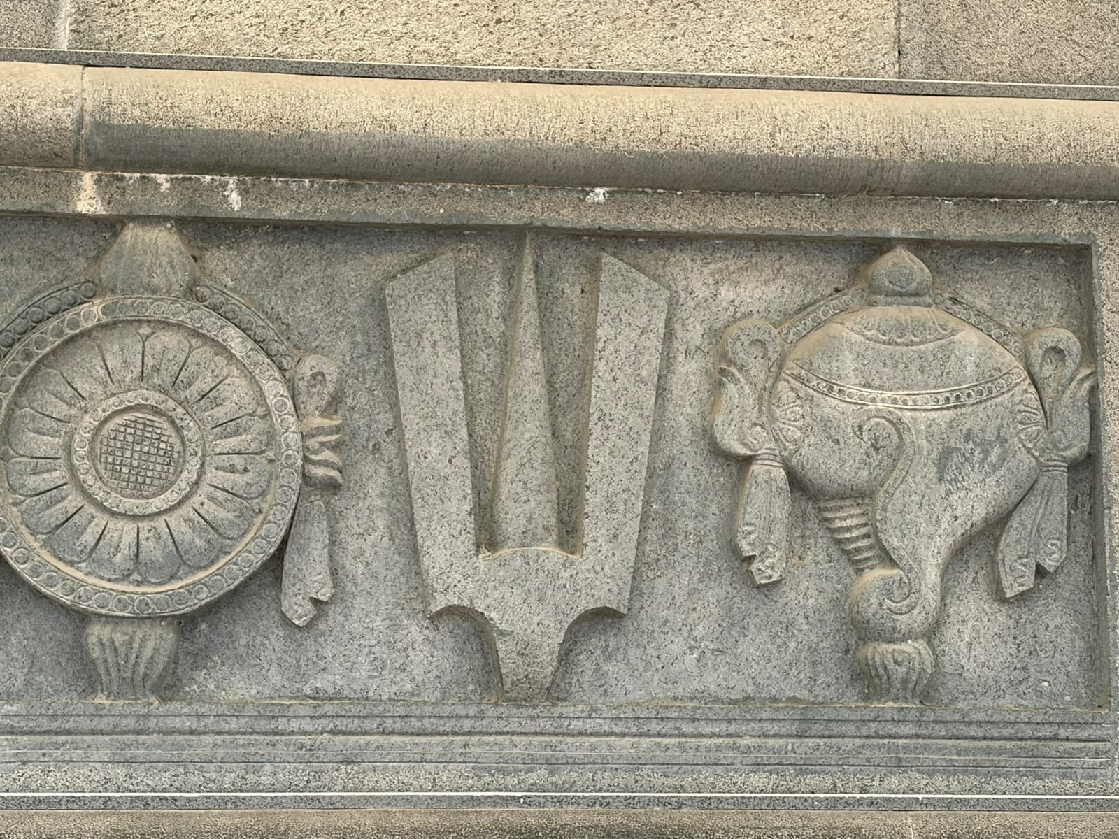 Chakra, Vaishnava sacred mark and shankha carved into stone at Swarnagiri.